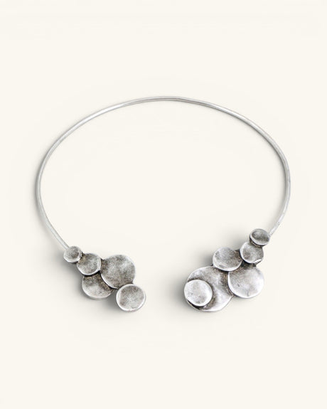 Silver-plated pewter collar necklace shown open on white background, stacked disc clusters visible at both wire ends