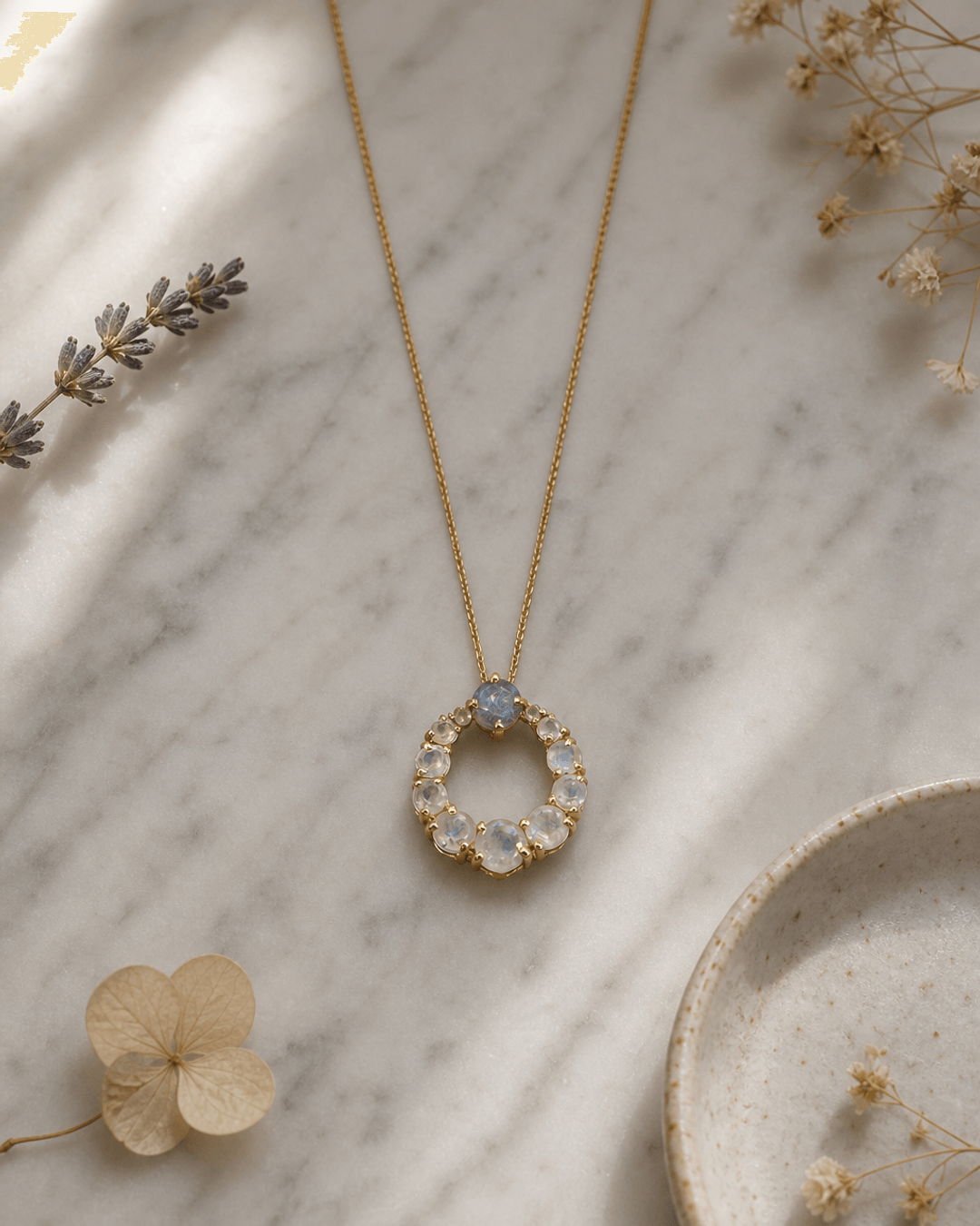 Rainbow Moonstone Circle Gold Plated Necklace — necklaces, editorial marble lifestyle photo