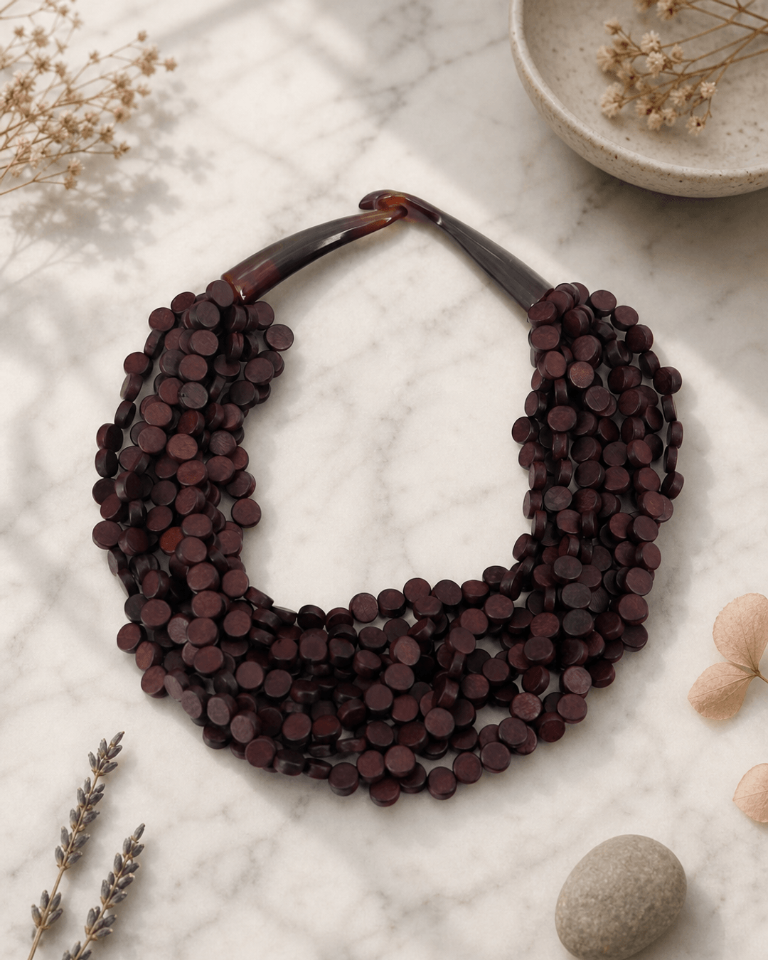 Rich Brown Twist Wood Necklace — necklaces, editorial marble lifestyle photo