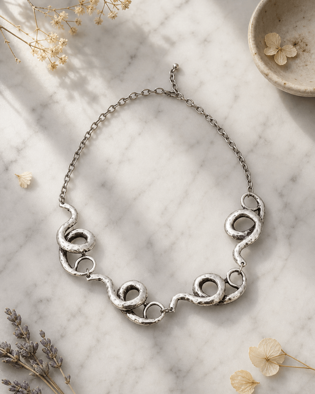 Sculpted Spiral Link Necklace — necklaces, editorial marble lifestyle photo