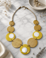 Shell Overlay Disc Necklace — necklaces, editorial marble lifestyle photo