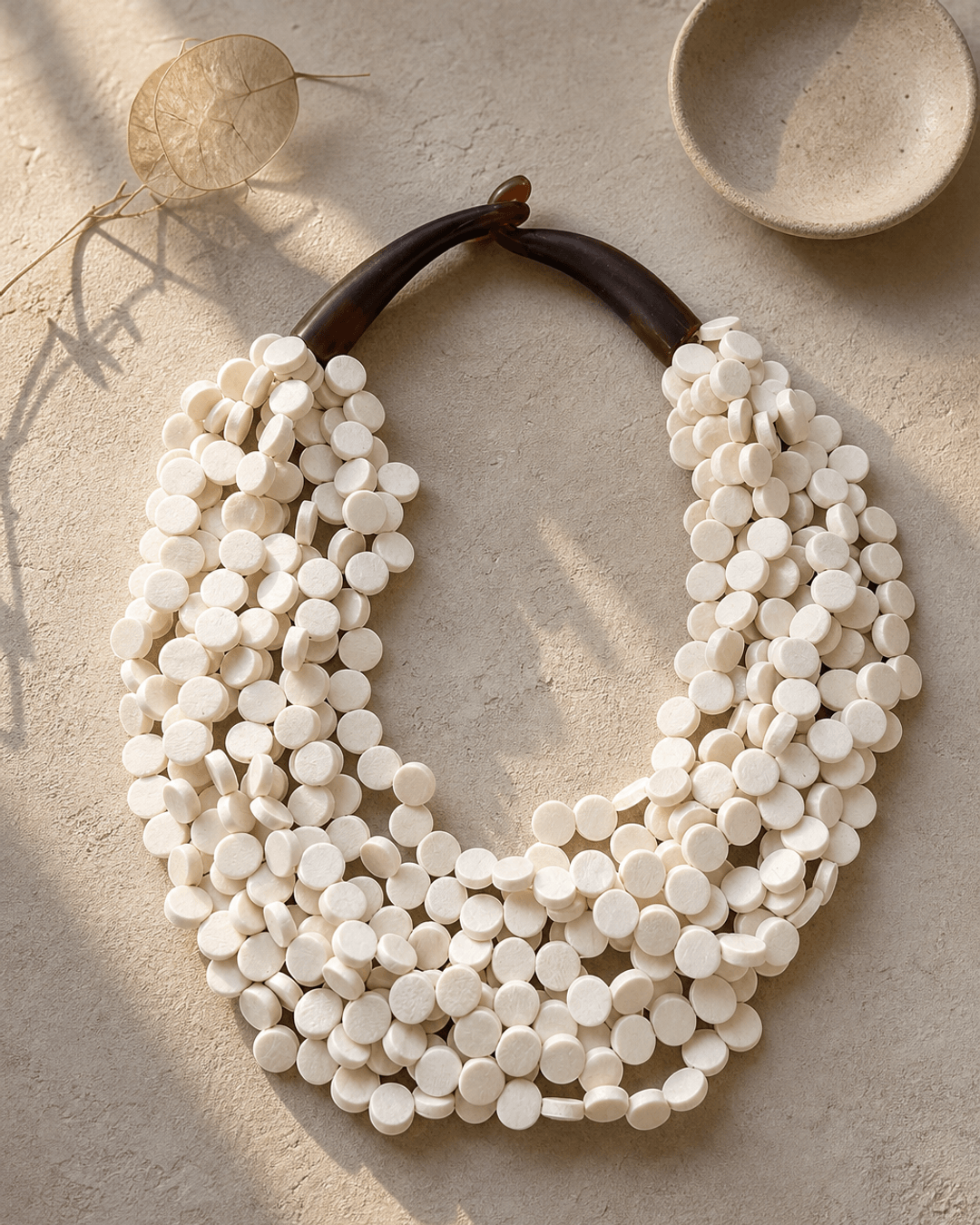 Soft White Twist Wood Necklace — necklaces, editorial plaster shadow lifestyle photo