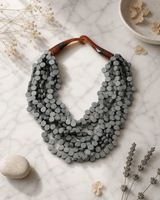 Soothing Grey Twist Wood Necklace — necklaces, editorial marble lifestyle photo
