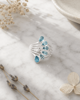 Sterling Silver Teardrop Gemstones Blue Topaz Ring — rings, editorial marble lifestyle photo