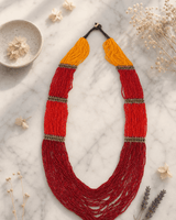 Sunrise Statement Beaded Necklace — necklaces, editorial marble lifestyle photo