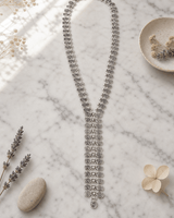 Swirly Circle Y-Shaped Necklace — necklaces, editorial marble lifestyle photo