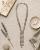 Swirly Circle Y-Shaped Necklace — necklaces, flatlay linen lifestyle photo