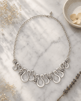 Swirly Curves Organic Necklace — necklaces, editorial marble lifestyle photo