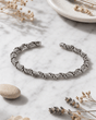 Hilltribe Sterling Silver Rope-Wrapped Adjustable Cuff Bracelet — bracelets, editorial marble lifestyle photo