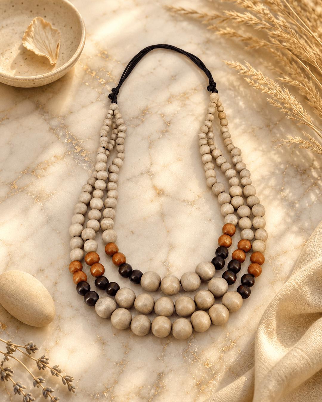 Tri-Color Layered Wood Bead Necklace — necklaces, editorial marble warm lifestyle photo