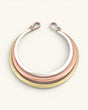 Tri-Tone Brass Collar Necklace front view on white background, three concentric silver, copper, and brass rings with hook clasps at top