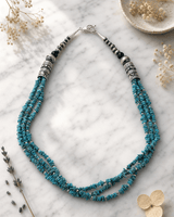 Triple-Strand  Genuine Turquoise Chips and Sterling Silver Bead Necklace - Southwest-Inspired, Handcrafted in USA — necklaces, editorial marble lifestyle photo