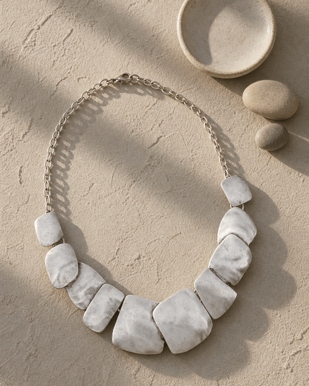 Tumbled Form Statement Necklace — necklaces, editorial plaster shadow lifestyle photo