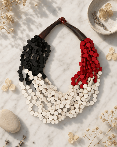 Twisted Multi-Strand Black, Red, and White Necklace — necklaces, editorial marble lifestyle photo
