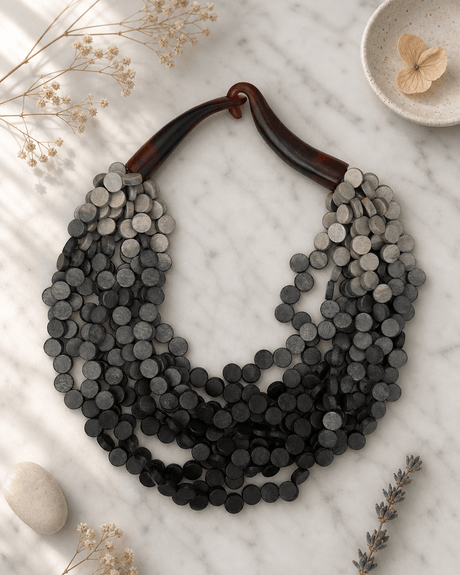 Twisted Multi-Strand Grey Ombre Wooden Disc Necklace — necklaces, editorial marble lifestyle photo