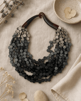 Twisted Multi-Strand Grey Ombre Wooden Disc Necklace — necklaces, flatlay linen lifestyle photo