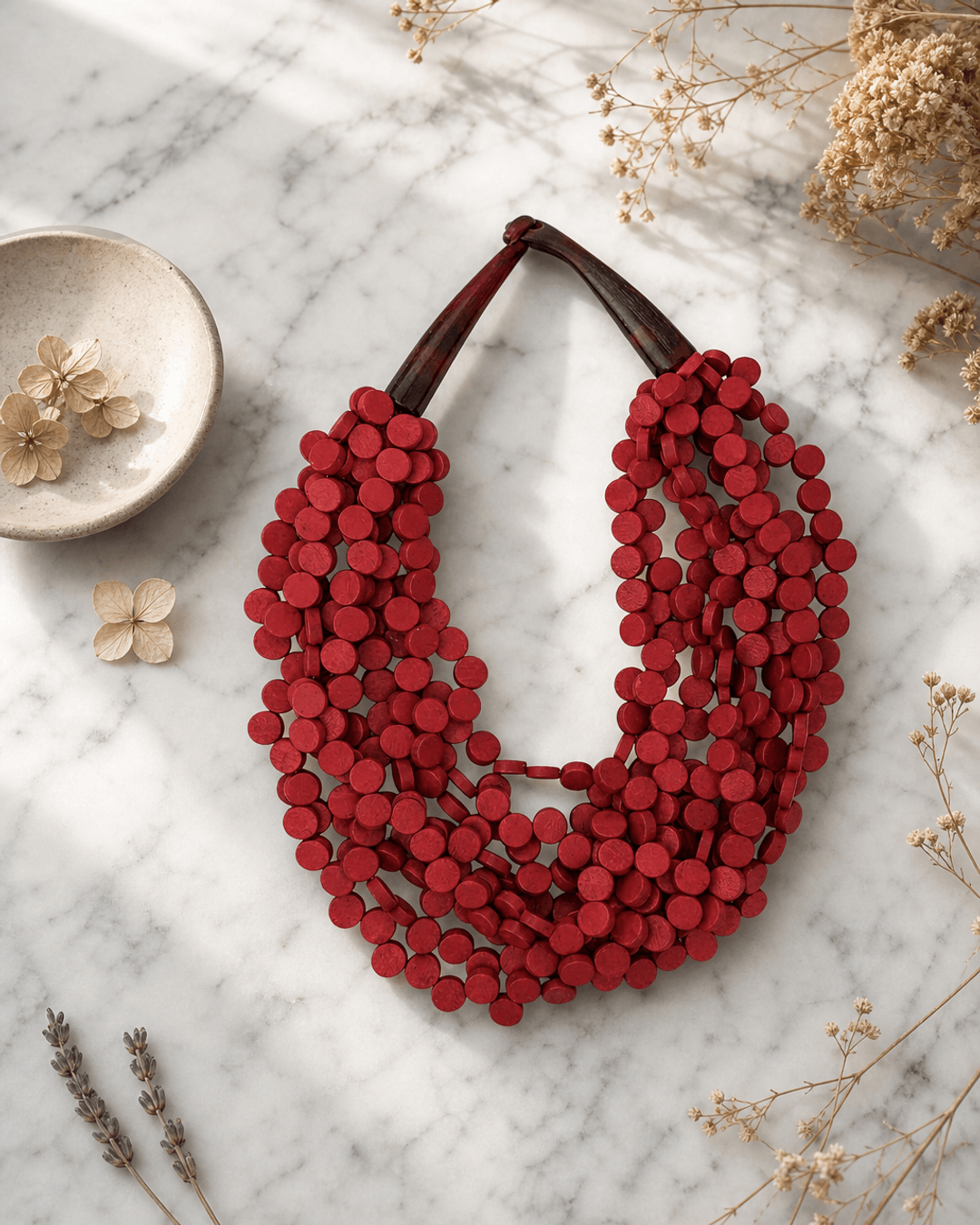 Twisted Multi-Strand Red Necklace — necklaces, editorial marble lifestyle photo