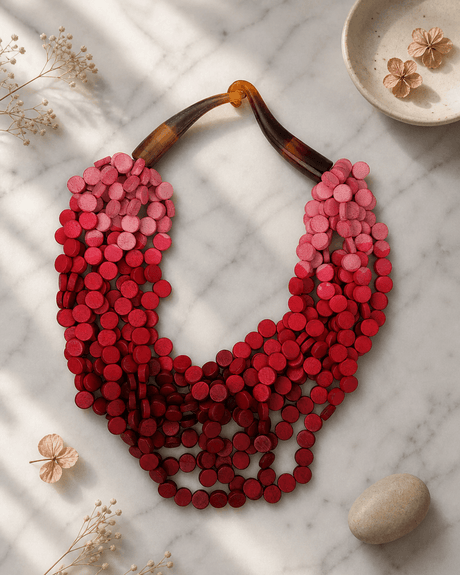 Twisted Multi-Strand Shades of Red and Pink Necklace — necklaces, editorial marble lifestyle photo