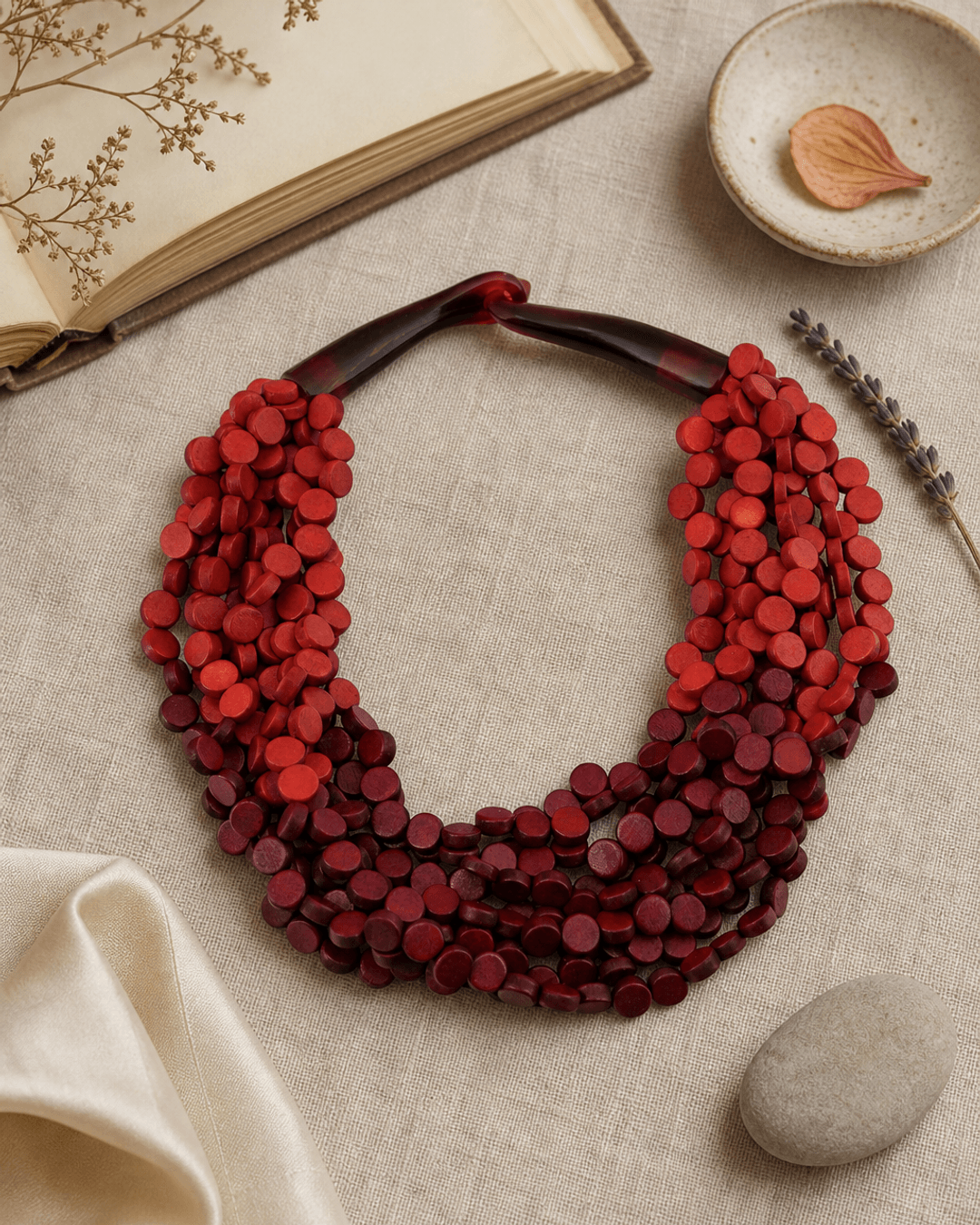Two-Tone Twist Wood Disc Necklace — necklaces, flatlay linen lifestyle photo