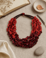Two-Tone Twist Wood Disc Necklace — necklaces, flatlay linen lifestyle photo