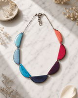 Vibrant Crescent Tagua Necklace — necklaces, editorial marble lifestyle photo
