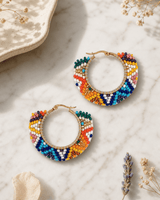 Vibrant Vista Handwoven Beaded Hoop Earrings — earrings, editorial marble lifestyle photo