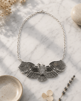 Wings of Power Eagle Necklace — necklaces, editorial marble lifestyle photo