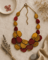 Yellow and Red Dyed Horn Necklace — necklaces, flatlay linen lifestyle photo