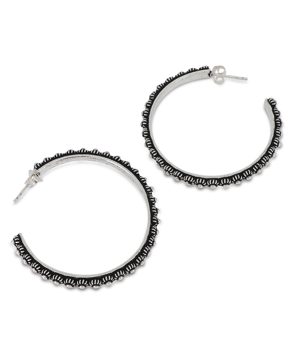 Laotian hill tribe silver hoop earrings with butterfly hook backing, measuring 1.75 inches tall"