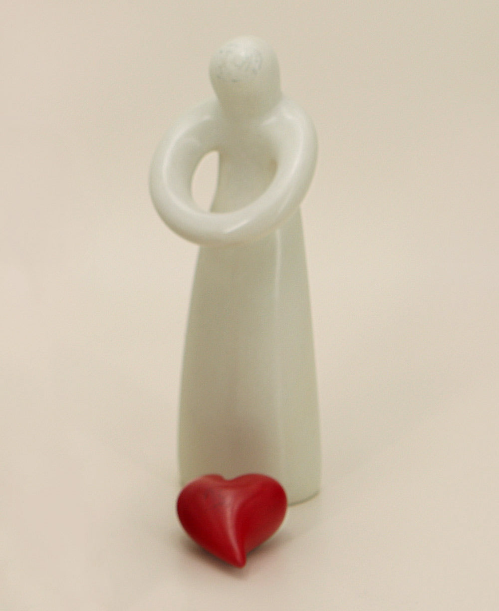 Soapstone hugging heart abstract sculpture in white