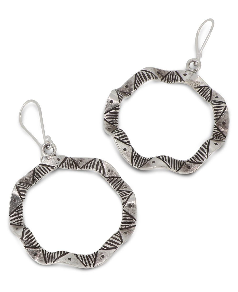 Handcrafted silver circular wavy earrings inspired by Laotian culture and artistry